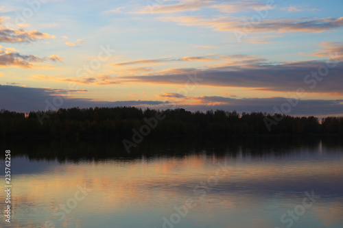 Fototapeta Naklejka Na Ścianę i Meble -  Misty morning sunrise reflection in a lake.