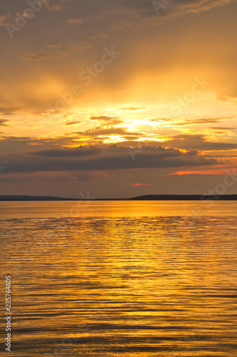 The sun setting over Waskesiu Lake in Prince Albert National Park of Canada. photo