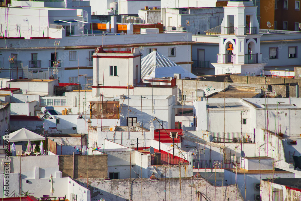Fototapeta premium The whitewashed buildings of Cadiz, Spain compressed together by a zoom lens in an aerial photograph.