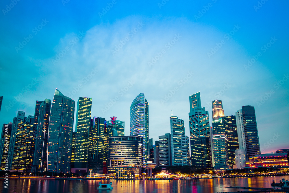 The business District of Singapore across Marina Bay during the blue hour.