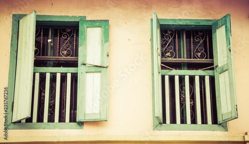 Old green shutters on a home in the Little Arabia district of Singapore.