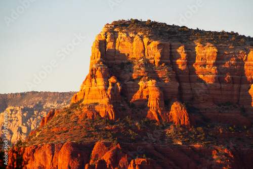 Evening light reflected on the cliff sides of the mountains of Sedona, Arizona.