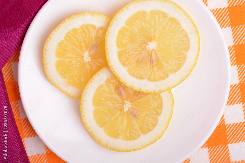 cut a lemon in an old white plate cut a lemon in an old white plate