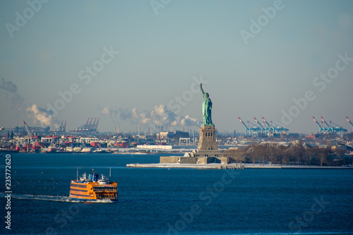 Statue of Liberty seen from Brooklyn on a cold, snowy and sunny winter's day