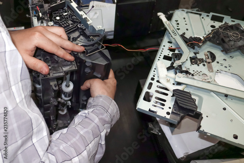 Repair of the laser printer in the service center. Professional replacement of thermal transfer unit. photo