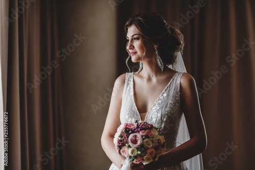 Gorgeous bride in a beautiful dress. Morning newlyweds.