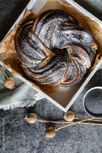 Poppy seed braid bread studded with powdered sugar photo