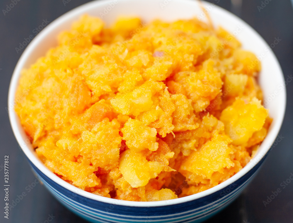 A bowl of mashed carrot and swede