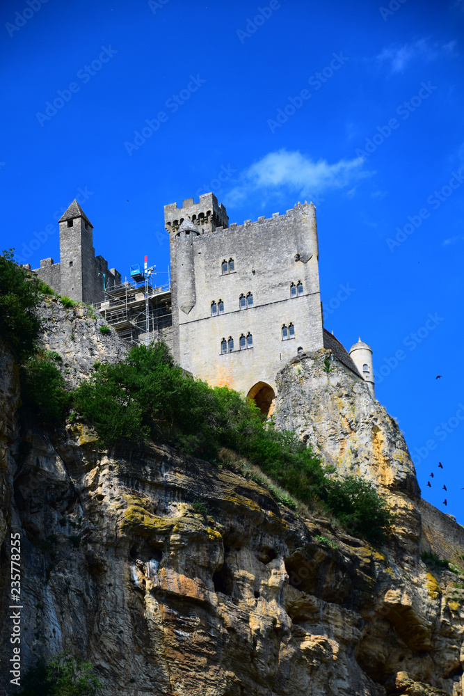 The medieval fortress of Beynac as seen from the Dordogne River in Aquitaine, France