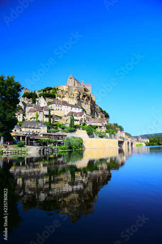 The medieval fortress and village of Beynac as seen from the Dordogne River in Aquitaine, France