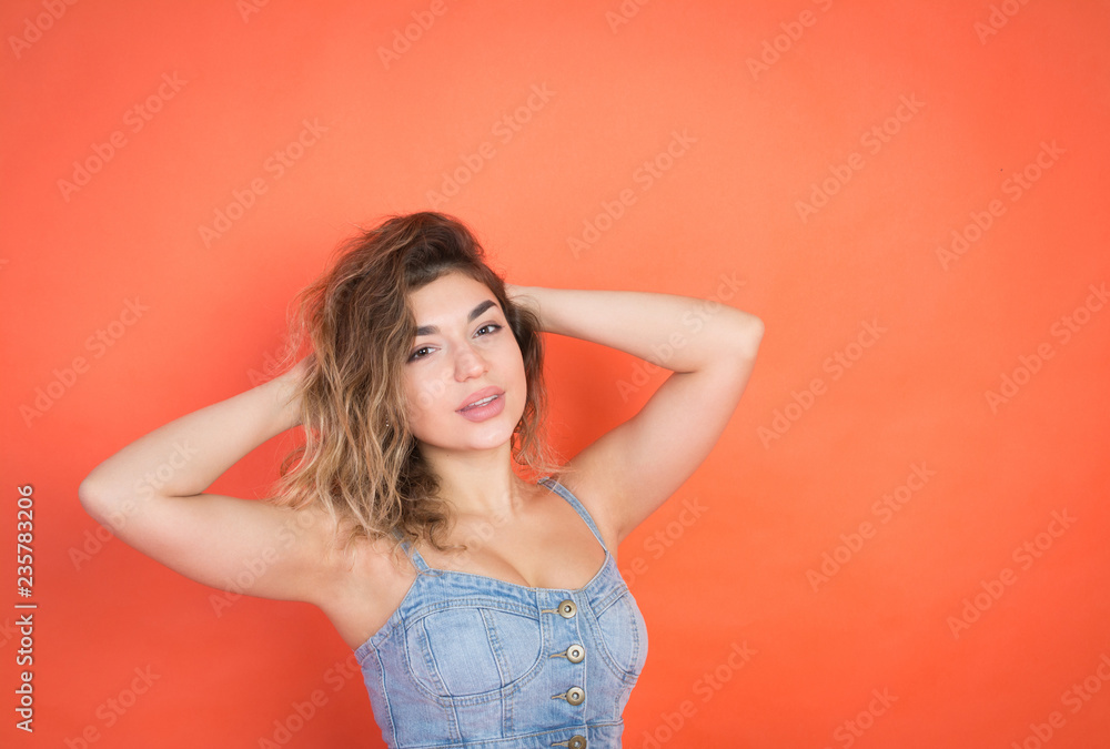 portrait of sexy beautiful girl with curly hair in jeans clothes portrait of sexy beautiful girl with curly hair in jeans clothes