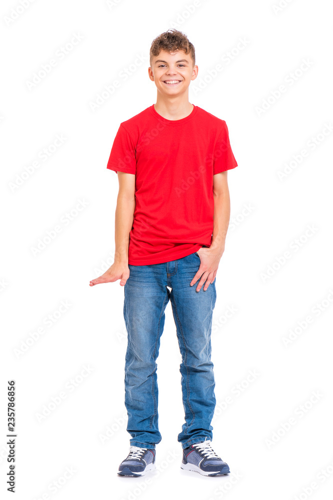 Fototapeta premium Full length portrait of young caucasian teen boy isolated on white background. Funny teenager showing something by hand. Handsome child looking at camera and smiling.