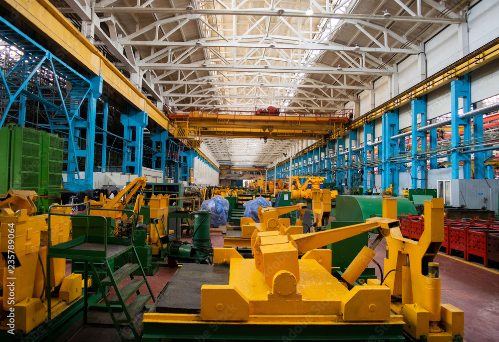 Line, conveyor for the production of large yellow trucks, mining trucks. Shop factory.