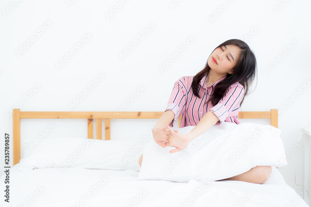 Beautiful of portrait young asian woman stretch and relax in bed after wake up morning at bedroom, new day and resting for wellness, lifestyle concept. Beautiful of portrait young asian woman stretch and relax in bed after wake up morning at bedroom, new day and resting for wellness, lifestyle concept.