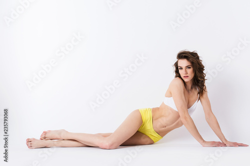 Young sports woman lying on the floor.