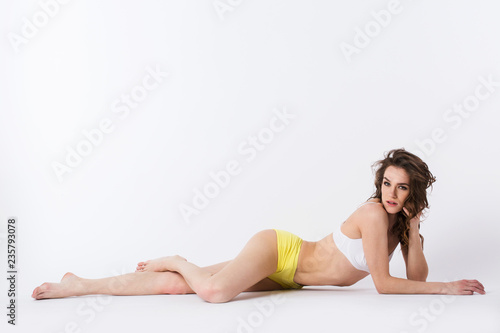 Woman in sportswear lying on the floor.