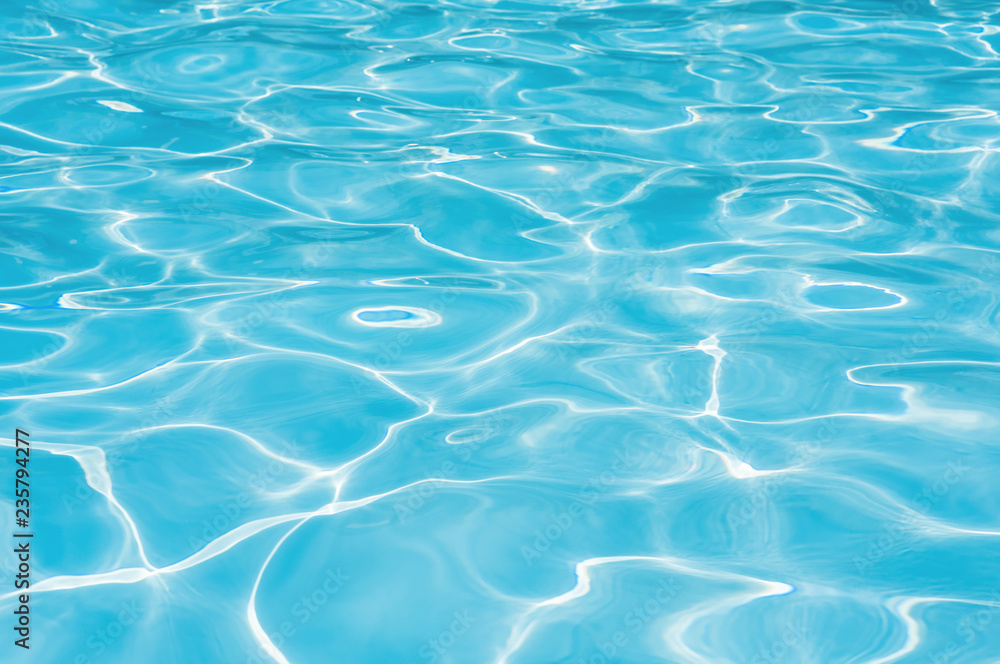 Blue water in swimming pool, Ripple wave in pool for background and abstract, Reflection water with shiny in poolside