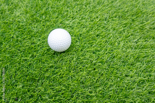 golf ball is on green gras