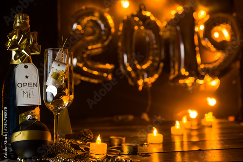 New Years Eve celebration conceptual photo,with two champagne glass, in the background 2019 made with inflatbale ballons.