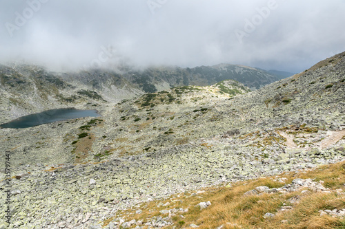 Landscape with fog over Musalenski lakes,  Rila mountain, Bulgaria photo