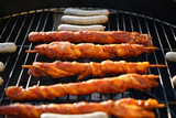 Glowing coals to hotdog grill with a charcoal barbecue in the garden
