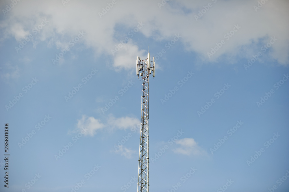 Obraz premium broadcast pole and telephone transceiver with blue sky 