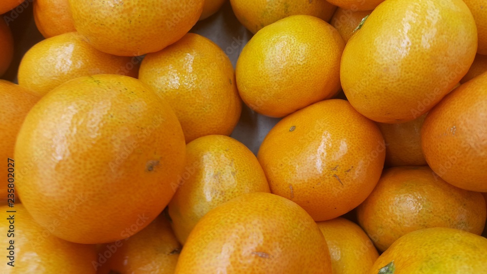 Fresh oranges in supermarket for sale, pile of orange in market for texture Fresh oranges in supermarket for sale, pile of orange in market for texture