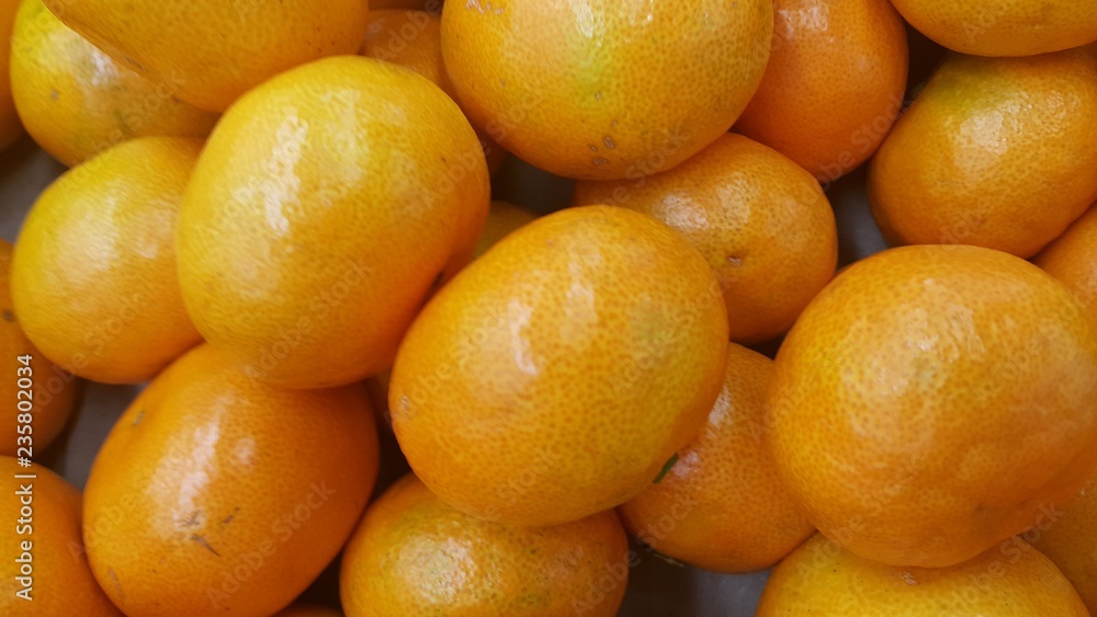 Fresh oranges in supermarket for sale, pile of orange in market for texture Fresh oranges in supermarket for sale, pile of orange in market for texture