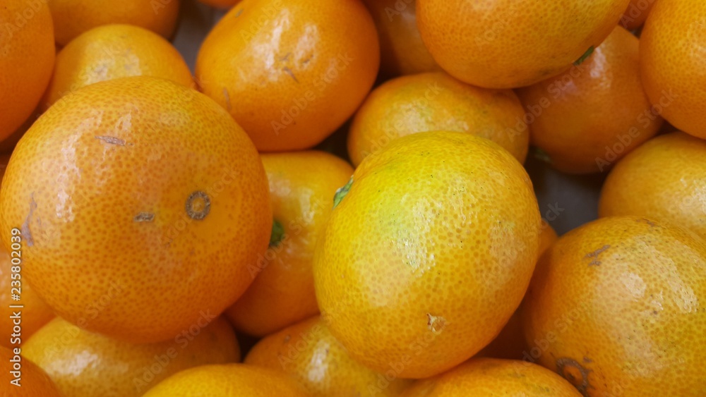 Fresh oranges in supermarket for sale, pile of orange in market for texture Fresh oranges in supermarket for sale, pile of orange in market for texture