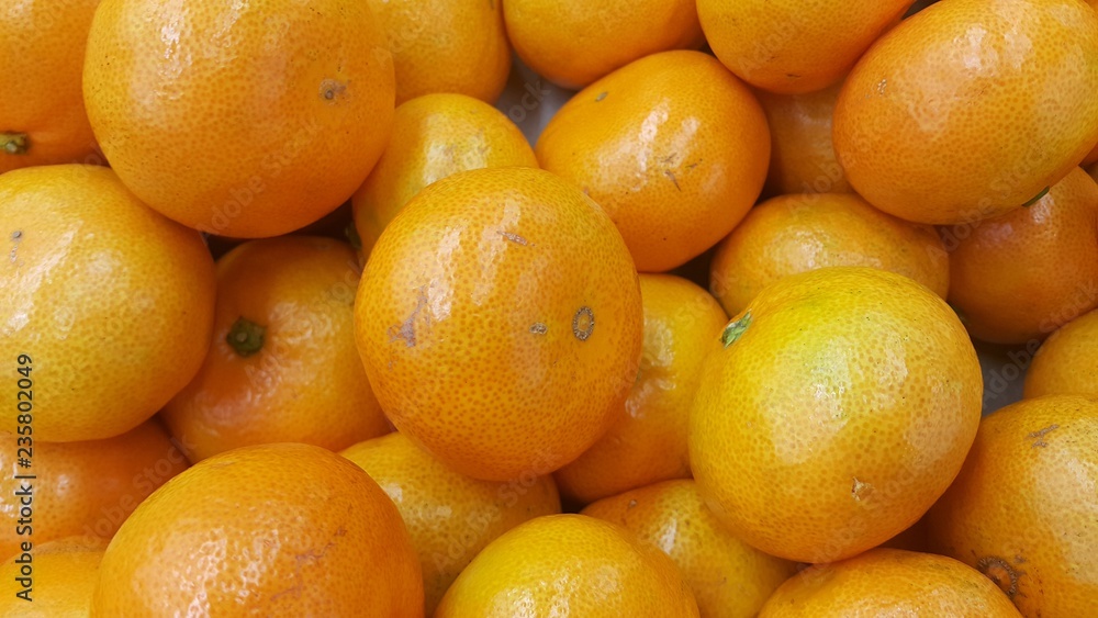 Fresh oranges in supermarket for sale, pile of orange in market for texture Fresh oranges in supermarket for sale, pile of orange in market for texture