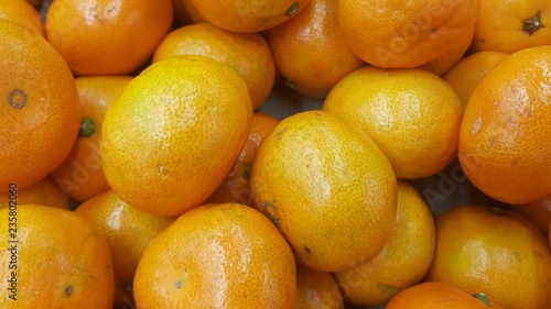 Fresh oranges in supermarket for sale  pile of orange in market for texture