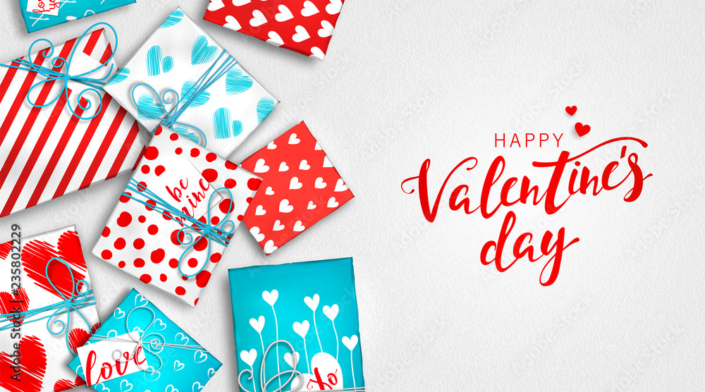 Obraz premium Saint Valentine's day background. Gift boxes in wrapping paper with hearts. Red and blue presents box of colorful cardboard tied with twine. Beautiful greeting card, banner on celebration of day love