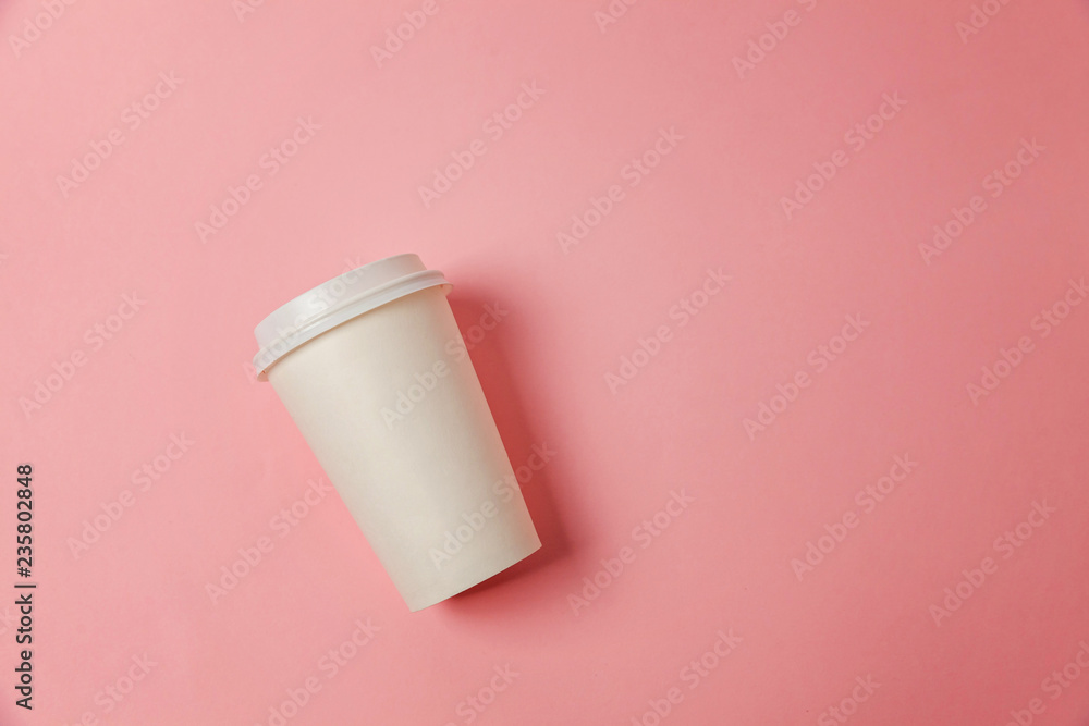 Simply flat lay design paper coffee cup on pink pastel colorful trendy background. Takeaway drink container. Good morning wake up awake concept. Template of drink mockup. Top view copy space Simply flat lay design paper coffee cup on pink pastel colorful trendy background. Takeaway drink container. Good morning wake up awake concept. Template of drink mockup. Top view copy space