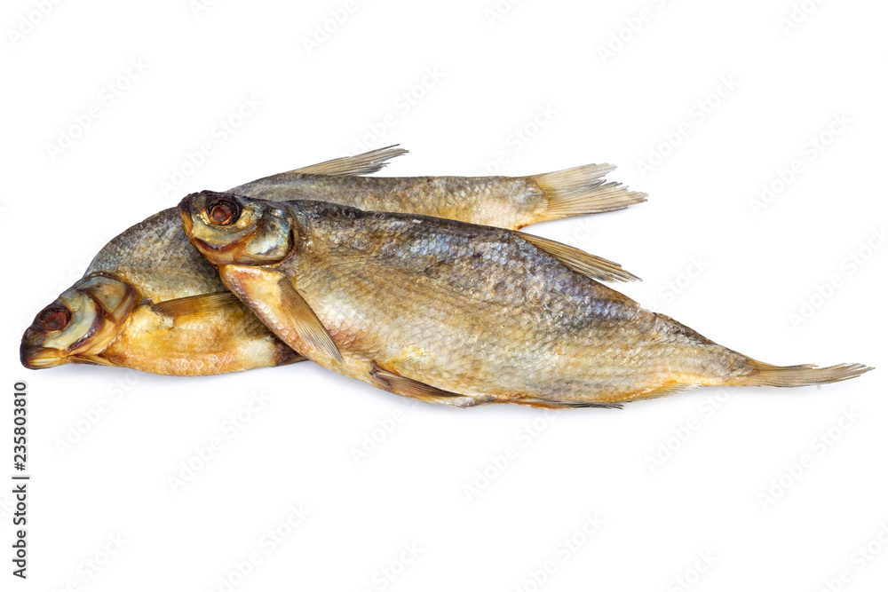 two dried salted fish isolated on white backdrop. Traditional russian food processing to preserve nutritional properties