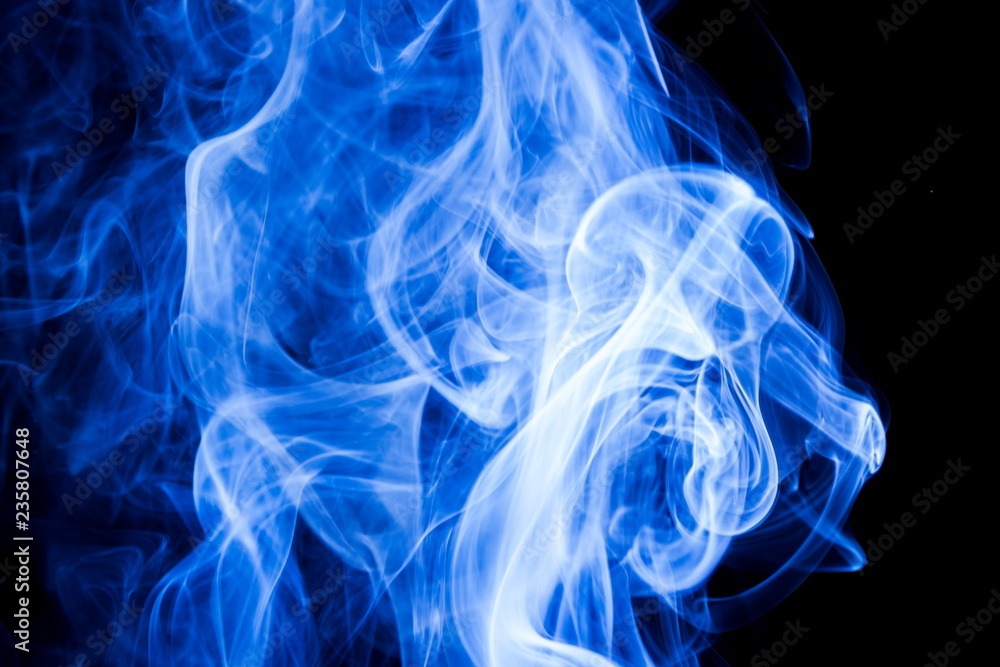 Fototapeta premium Blue smoke on black background
