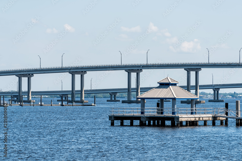 Bridges in marina harbor dock on Caloosahatchee River during sunny day in Florida gulf of mexico coast, pier, nobody, gazebo pavilion in Fort Myers, USA