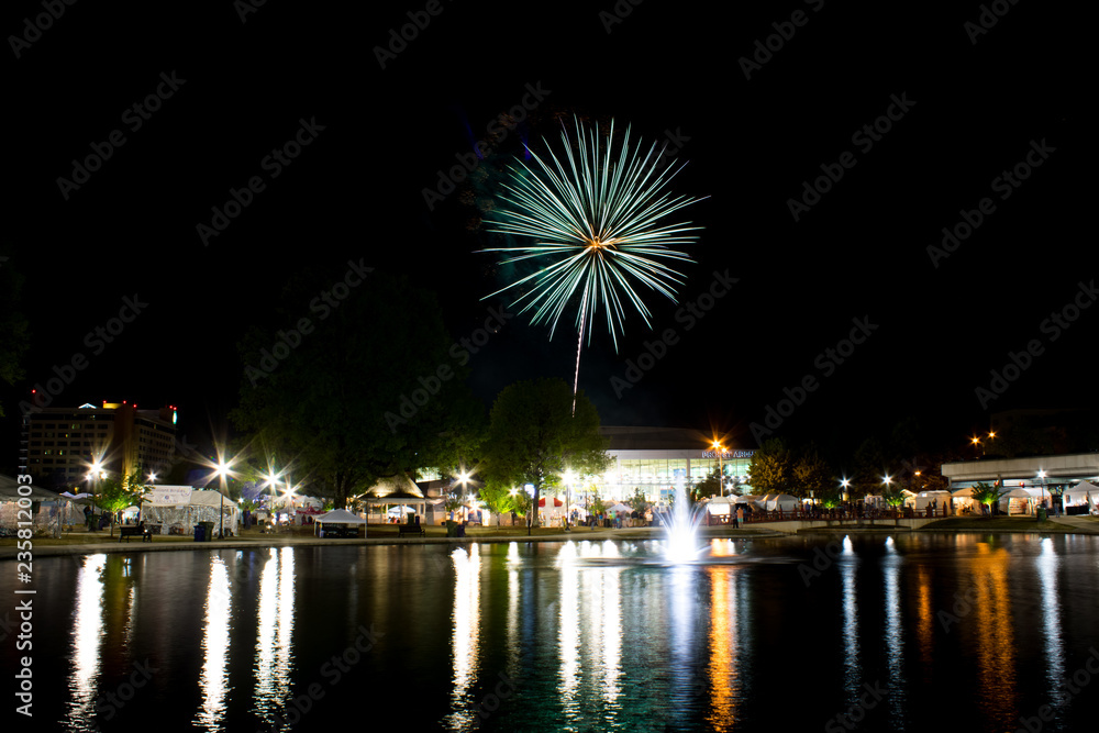 Fireworks at night on the water