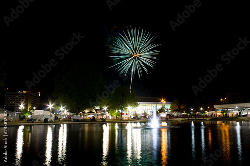 Fireworks at night on the water