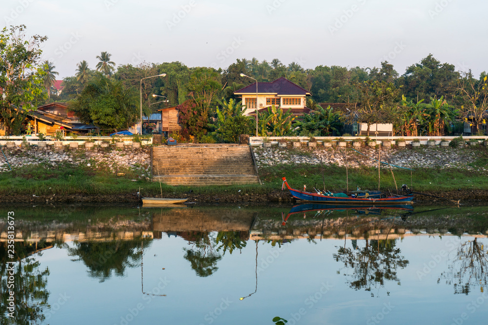 The beautiful morning view landscape of riverside village in the rural of Thailand