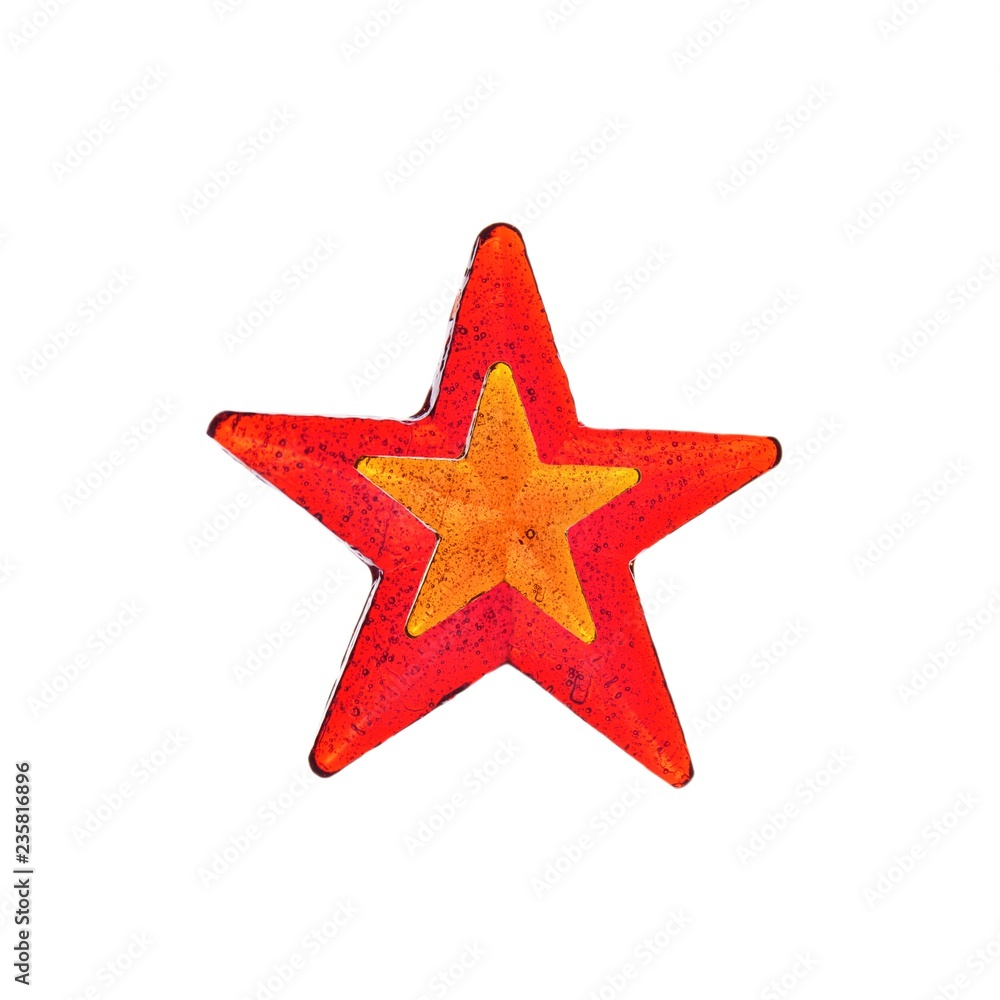 Red and orange star shaped lollipop isolated. Homemade lollipop. Red and orange star shaped lollipop isolated. Homemade lollipop.