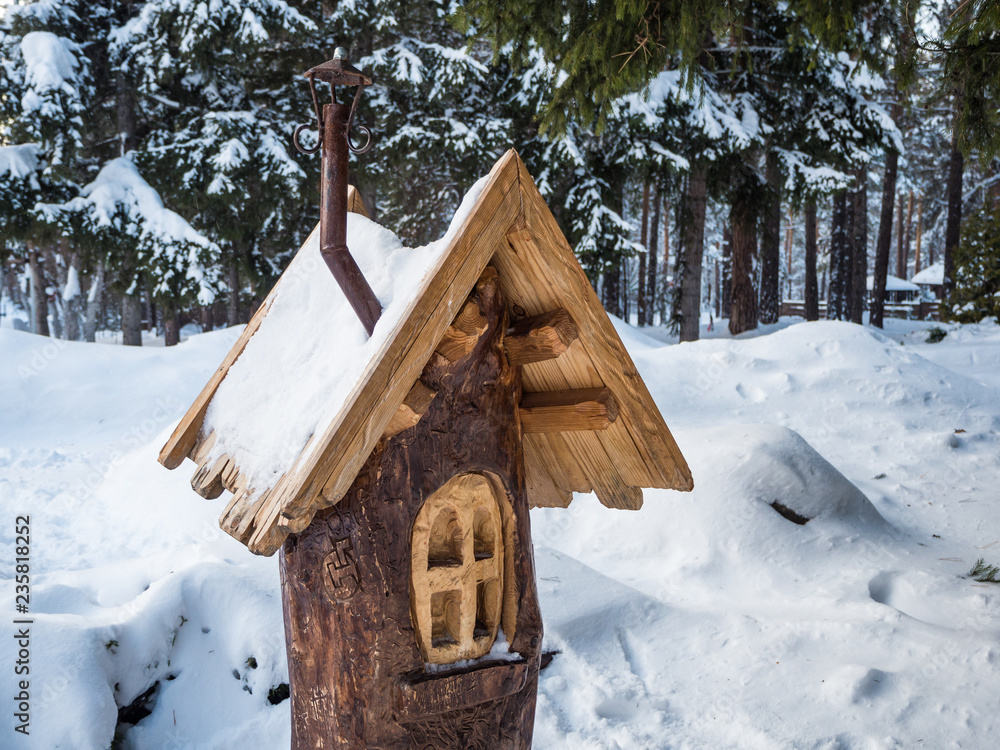 bird feeder in the form of a house under the snow, Novosibirsk, Russia bird feeder in the form of a house under the snow, Novosibirsk, Russia