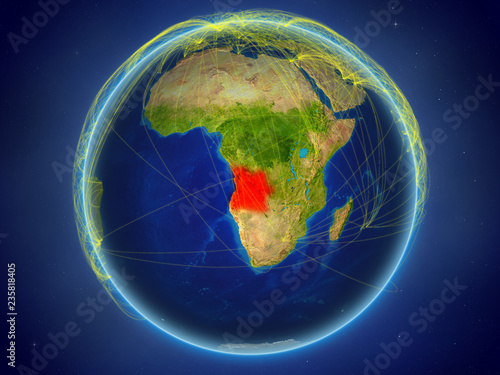 Angola from space on planet Earth with digital network representing international communication  technology and travel.