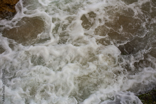 Waves during a storm. View from above. Red code. Rest on the Black Sea coast in Bulgaria. Elemental force.