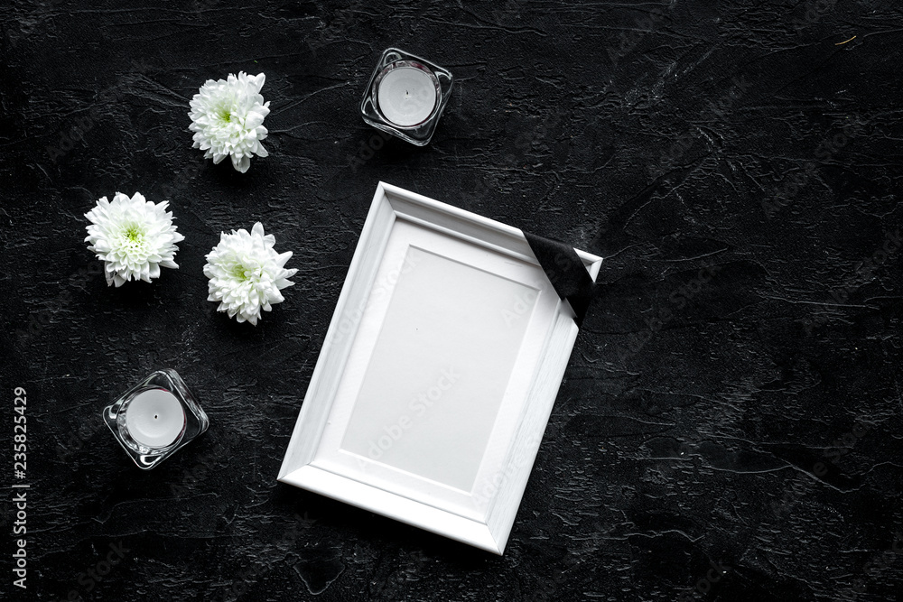 Death concept. Photo frame, mockup with black ribbon near flowers, candles  on black background top view copy space Stock Photo | Adobe Stock