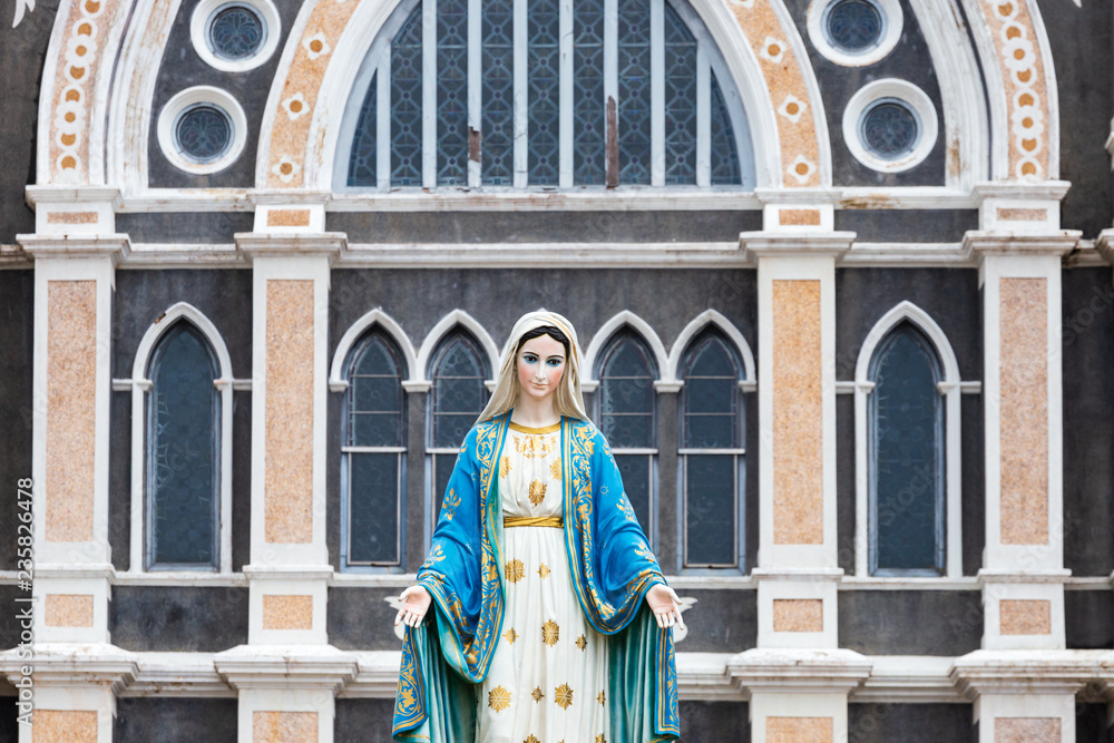 The Blessed Virgin Mary,mother of Jesus on the blue sky, in front of the Roman Catholic Diocese, public place in Chanthaburi, Thailand.