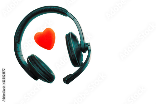 Black and Green Headset, Headphones with Microphone and Red Heart Isolated On White Background.  Call Center, Technical Support, Love, Valentines Day, Medicine, Music Concept.