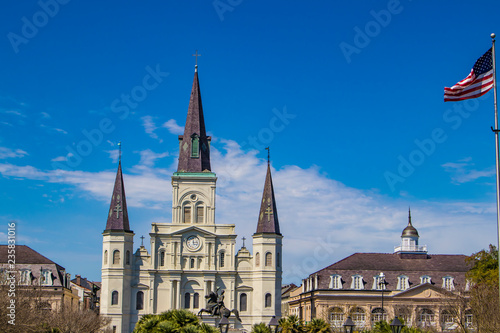 Panoramic View of the St. Louis Cathedral, the Andrew Jackson Statue, and the Presbytere Museum with the American Flag in the Right Corner in Jackson Square, New Orleans, Louisiana, USA