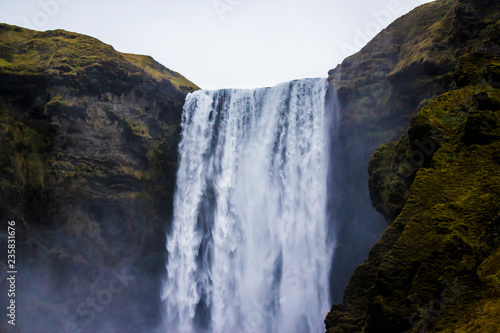 Mist Rising up from the Cliffs of Skogafoss Waterfall in the Golden Circle of Iceland