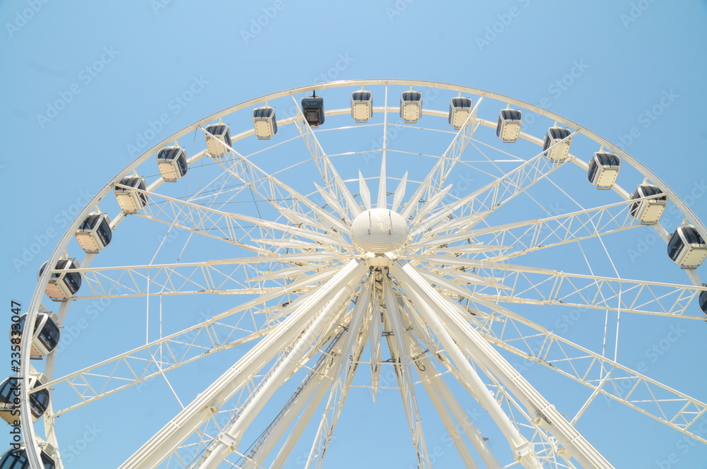 ferris wheel with blue sky background