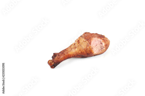 roasted chicken leg with bite taken, isolated on white background.